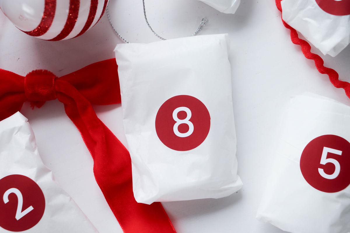 Wrapped advent crystal parcels numbered 2, 5 and 8
